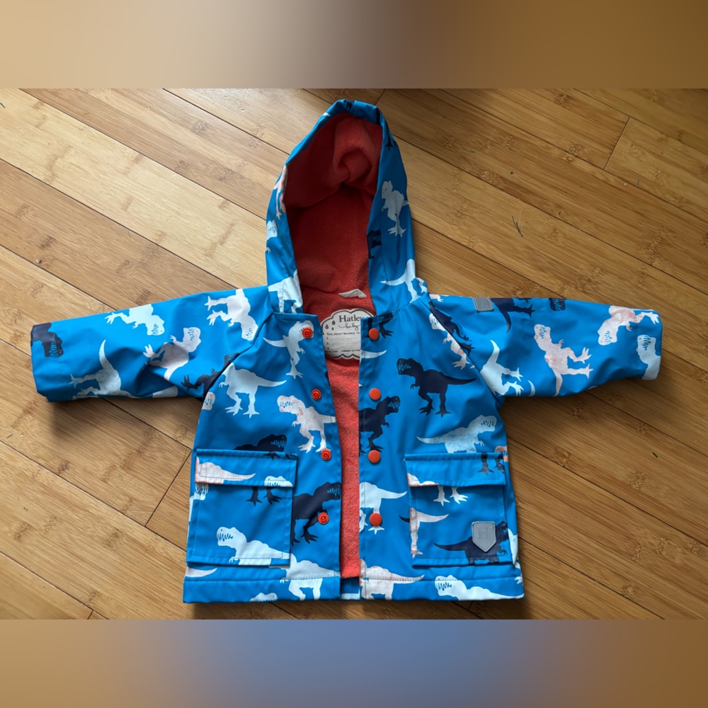 Hatley dinosaur raincoat. Baby size 9-12 months. Color changing. Lined interior.